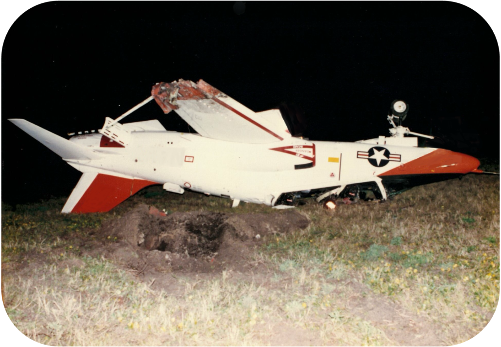 Picture of T-45 jet after crash, flipped over